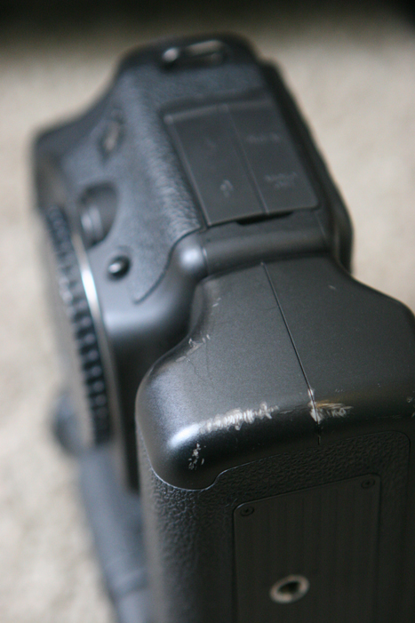 Imperfections: Standard wear scratches on bottom of battery grip.