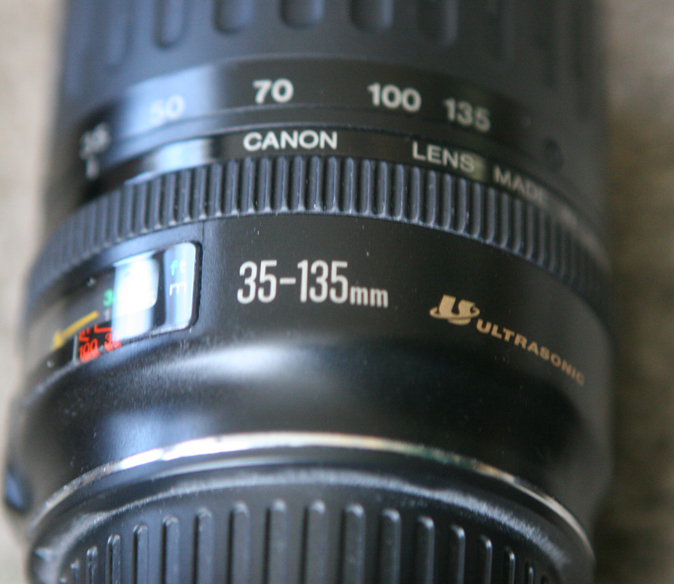 Canon 35-135mm f4-5.6 USM lens with lens hood.